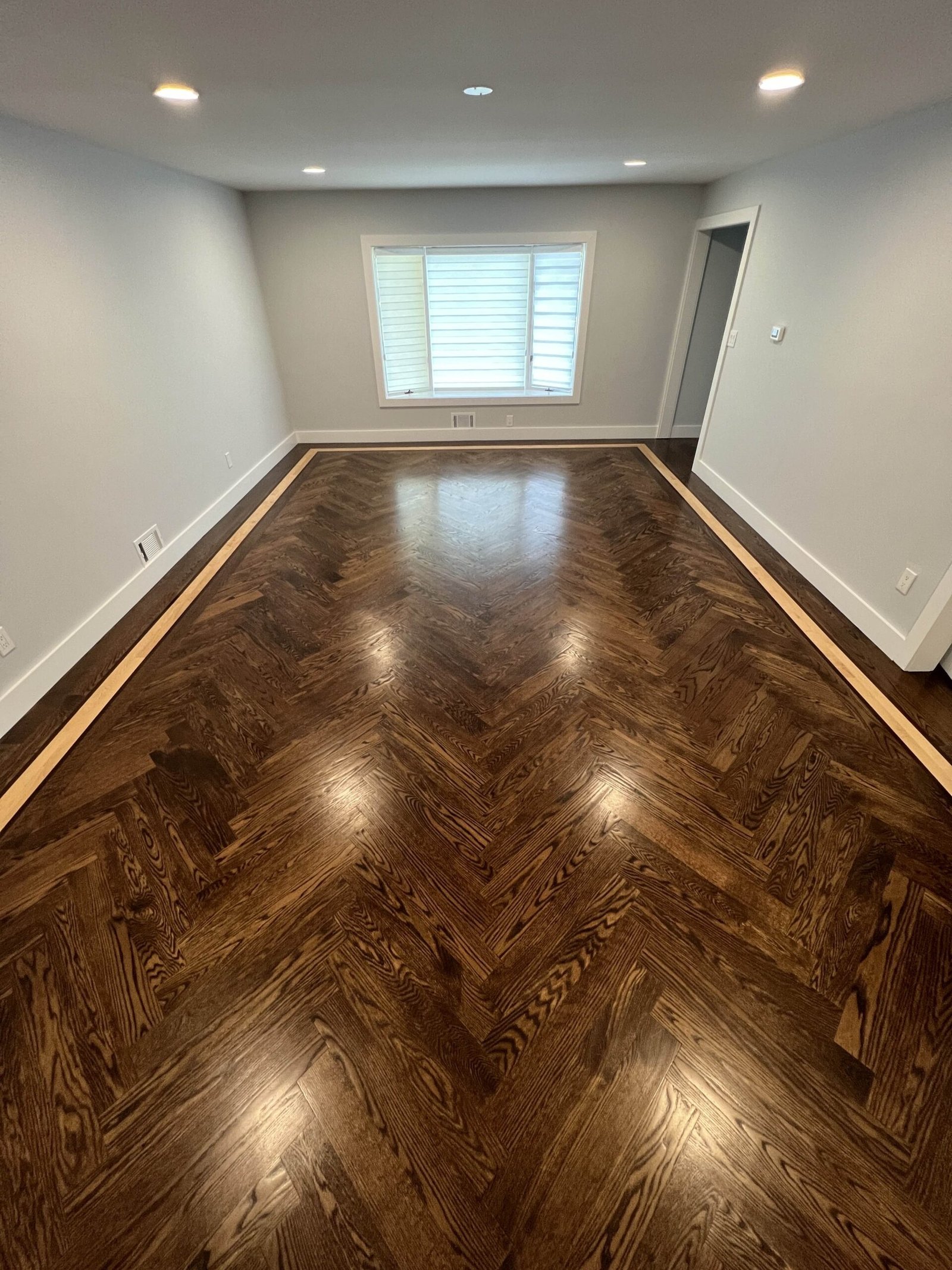 Living Room with Herringbone Hardwood Floors